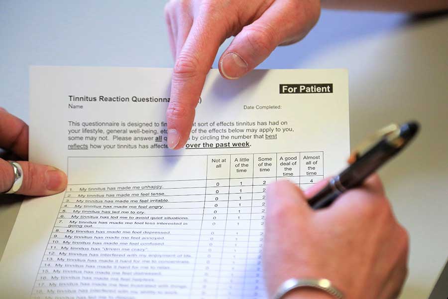 photo of a client filling in a tinnitus questionnaire